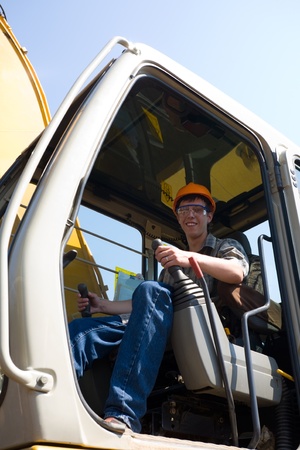 Operator of a excavator(dredge) on a working site.の写真素材