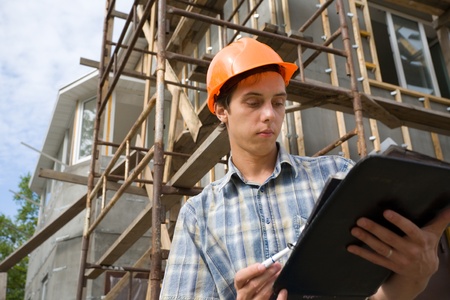 Building inspector on a working platform.の写真素材