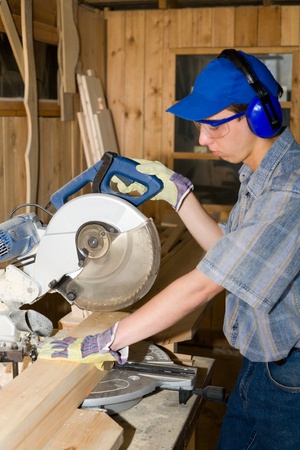 Carpenter(sawman) at work.の写真素材