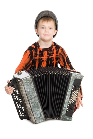 Smiling boy playing the accordion.の写真素材