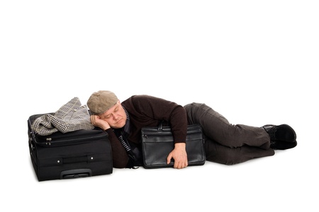 Tired man in anticipation of landing the plane lying on the floor.の写真素材
