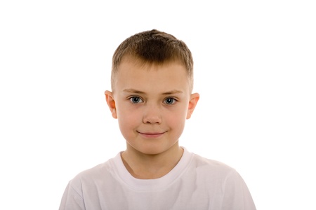 Smiling boy of eight years from the front. Children