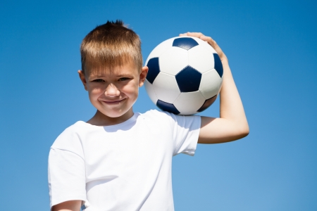 Boy holding a soccer ball.の写真素材