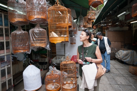 HONG KONG, CHINA - NOVEMBER 11, 2012  Tourists and locals in the bird market Bird Garden  Market is located on the Kowloon peninsula, and is one of the biggest and most popular bird markets in the world のeditorial素材