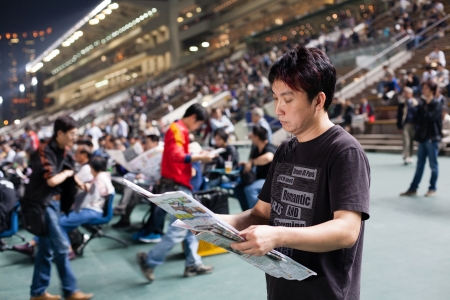 HONG KONG, CHINA - NOVEMBER 14, 2012: Sha Tin Racecourse - Spectators bet on the winner. Racecourse of the first class, very popular with locals and tourists, and accommodates 83,000 spectators.
のeditorial素材