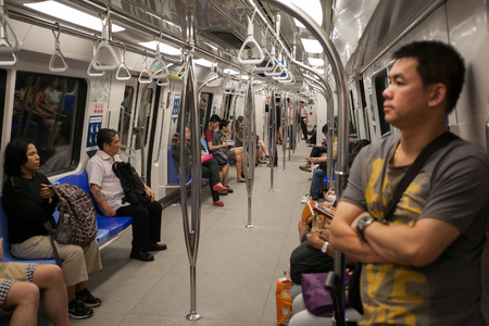 SINGAPORE - AUGUST 15  Passengers in the train subway Singaporeのeditorial素材