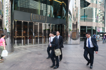 HONG KONG - SEPTEMBER 28, 2012  Businessmen on the Hong Kong Exchange Square  Here is a Two Exchange Square, where Is located international Hong Kong Stock Exchange  SEHK  のeditorial素材