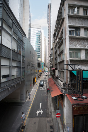 HONG KONG - NOVEMBER 1, 2011: Narrow roads for cars and unique, mixed on the traditions of east and west of Hong Kong architecture attract many tourists from around the world.のeditorial素材
