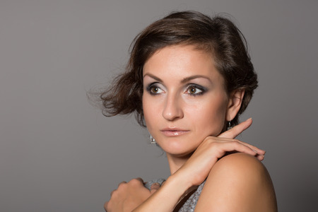 Charming woman looking to the side. Woman 36 years old.の写真素材