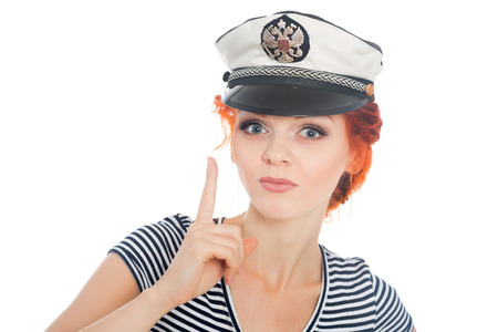 Sailor girl with a raised finger up. On his cap emblem of Russia.の写真素材