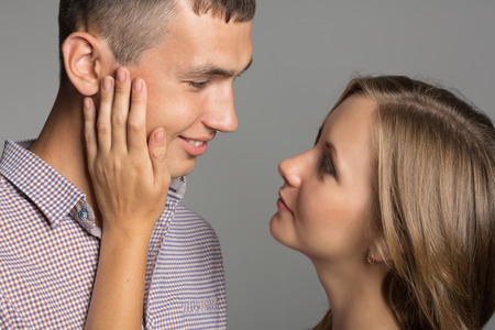 Enamoured guy and girl looking at each otherの写真素材