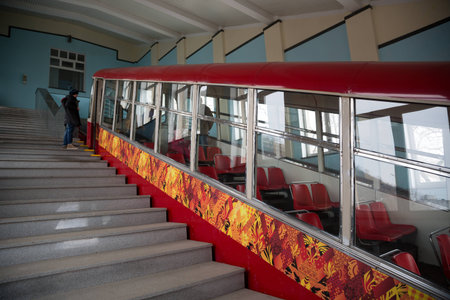 boy stands at the entrance to the car funicular. Vladivostok, Russia.のeditorial素材