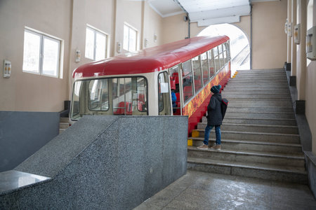 Boy comes into the car funicular. Vladivostok, Russia.のeditorial素材
