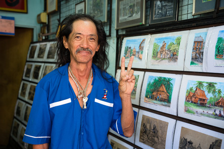 MALACCA, MALAYSIA - CIRCA JANUARY, 2015: Portrait of the artist from Malacca  in his art studio-store.のeditorial素材