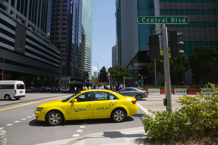 SINGAPORE - FEBRUARY 18, 2015: Singapore's Central Business District (CBD), the intersection Raffles Quay and Central Boulevard. The business district is a symbol of dynamic Singapore.のeditorial素材