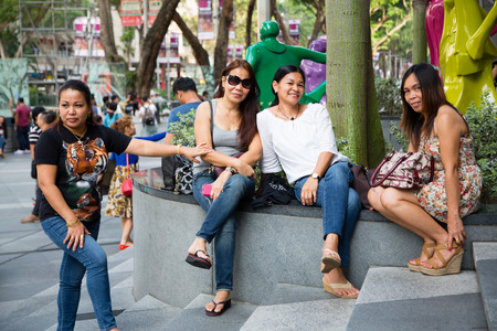 SINGAPORE - CIRCA FEBRUARY, 2015: People relax in the entertainment area at the mall ION Orchard - one the best shopping centers on Orchard Road. In the mall more than 300 shops of the famous brands.のeditorial素材