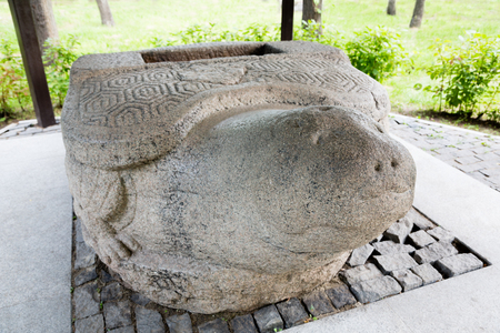 Sculpture stone turtle Jin Empire era, the 13th century. This Chinese stone sculpture was found in 1864 in the city of Nikolsk-Ussuriisk, Russia. Located in the city of Ussuriysk, Primorsky Krai, Russia.の写真素材