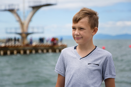 Portrait of a serious boy looking to the sideの写真素材