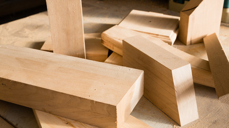 Wooden sticks on a workbench in the carpentry workshop