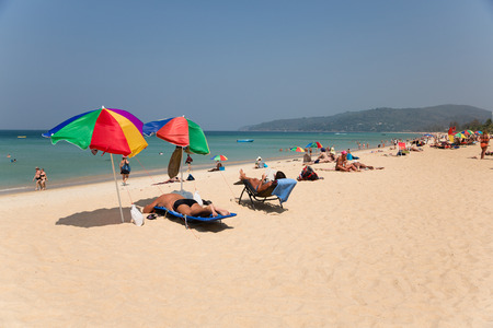 KARON BEACH, THAILAND - CIRCA FEBRUARY, 2015:  People relax on Karon beach. This is one of the most popular beaches among tourists in Phuket.のeditorial素材