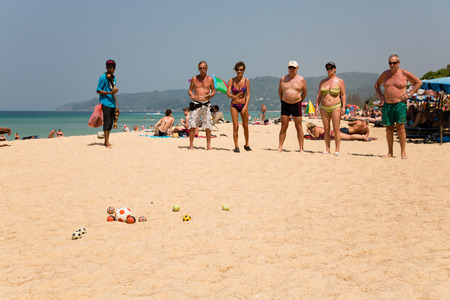 KARON BEACH, THAILAND - CIRCA FEBRUARY, 2015: European tourists are playing the French game boules (petanque). Karon beach is one of the most popular beaches among tourists in Phuketのeditorial素材