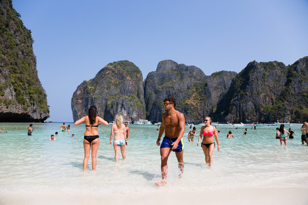 PHI PHI ISLANDS, THAILAND - CIRCA FEBRUARY, 2015: People relax on the famous beach of Maya Bay on Phi Phi Leh island. It starred the popular movie The Beach with the actor Leonardo DiCaprioのeditorial素材