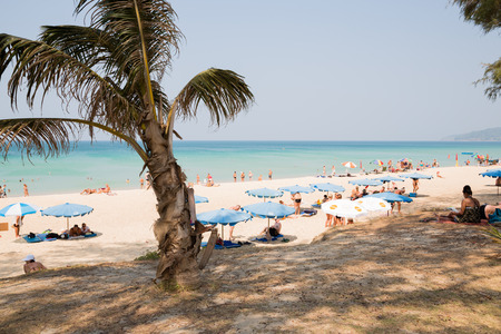 KARON BEACH, THAILAND - CIRCA FEBRUARY, 2015:  People relax on the sun loungers on Karon beach. This is one of the most popular beaches among tourists in Phuket island.のeditorial素材