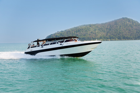 Cruise speed boat with tourists in the Andaman Sea, Thailand.の写真素材