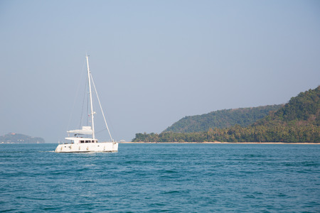 Catamaran walking among the islands on the Andaman Sea coast of Thailandの写真素材