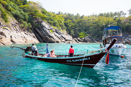 PHI PHI ISLANDS, THAILAND - CIRCA FEBRUARY, 2015: Traditional Thai boats on the shore of the island of Phi Phi Islands in the Andaman Sea. Islands is very popular with tourists from all over the worldのeditorial素材