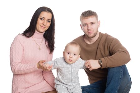 Young family father mother and little boy. Isolation on white.