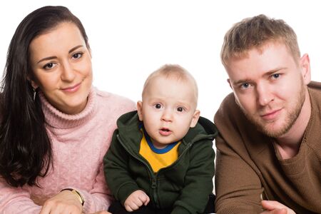 Portrait young family father mother and little boy. Isolated on white.の写真素材