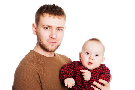 Father with a small son in his arms. Isolated on white.の写真素材