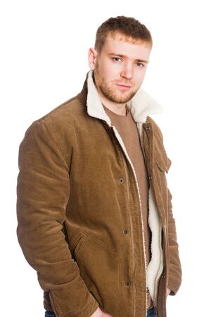 Portrait young European man in a winter jacket. Isolated on white.の写真素材