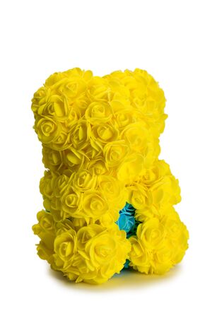 Artificial bouquet of yellow flowers in the shape of a bear. Isolated on white.
の写真素材