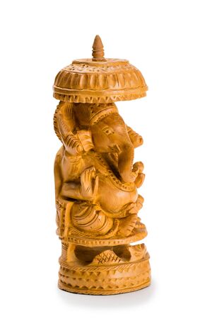 Miniature wooden sculpture depicting an elephant isolated on white.の写真素材