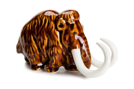 Miniature porcelain mammoth sculpture isolated on white.の写真素材