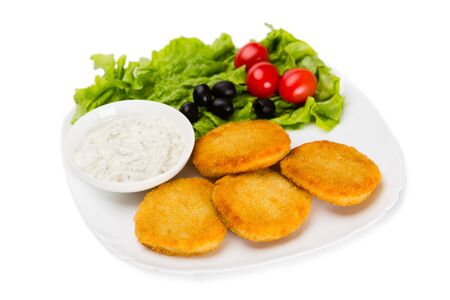 Fried fish cutlet with vegetables. Isolated on white.の写真素材