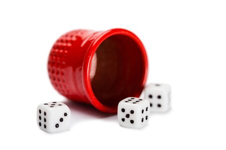 Thimble and miniature dice isolated on whiteの写真素材