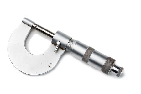 Old mechanical micrometer isolated on whiteの写真素材