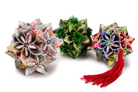 Origami Japan traditiona art in the shape of a ball - Kusudama isolated on whiteの写真素材