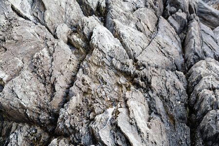 Background with natural stone rocks by the seaの写真素材