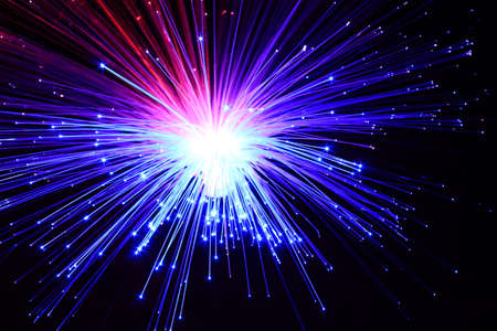 Light explosion effect background. Flying lights purple, red, blue. Big bang effect.の写真素材