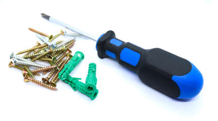 Blue screwdriver with dowels and screws Working tools.