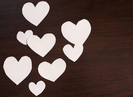 White hearts on a dark background.