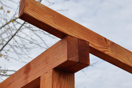 The connection of the rafter beam, the construction of the roof. Construction of a shed for wood.の写真素材