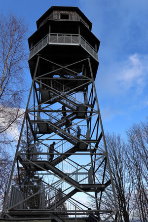 Public lookout tower Kabatice lookout tower near Frydek Mistek in the Czech Republic. Blue sky with clouds. Looking up.のeditorial素材