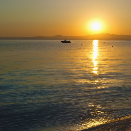 beautiful sunset over Greek coastsの写真素材