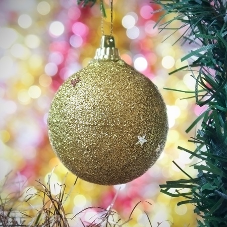 Gold ball as a decoration on Christmas treeの写真素材