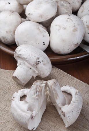 Close up photo of Fresh mushrooms on a wooden boardの写真素材